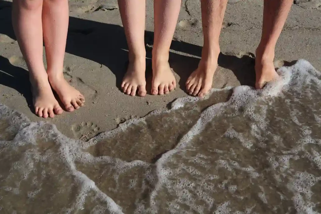 people on the beach barefeet