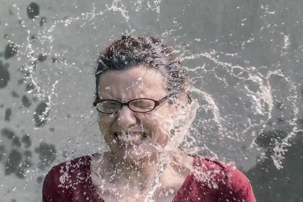 splashing water in womans face