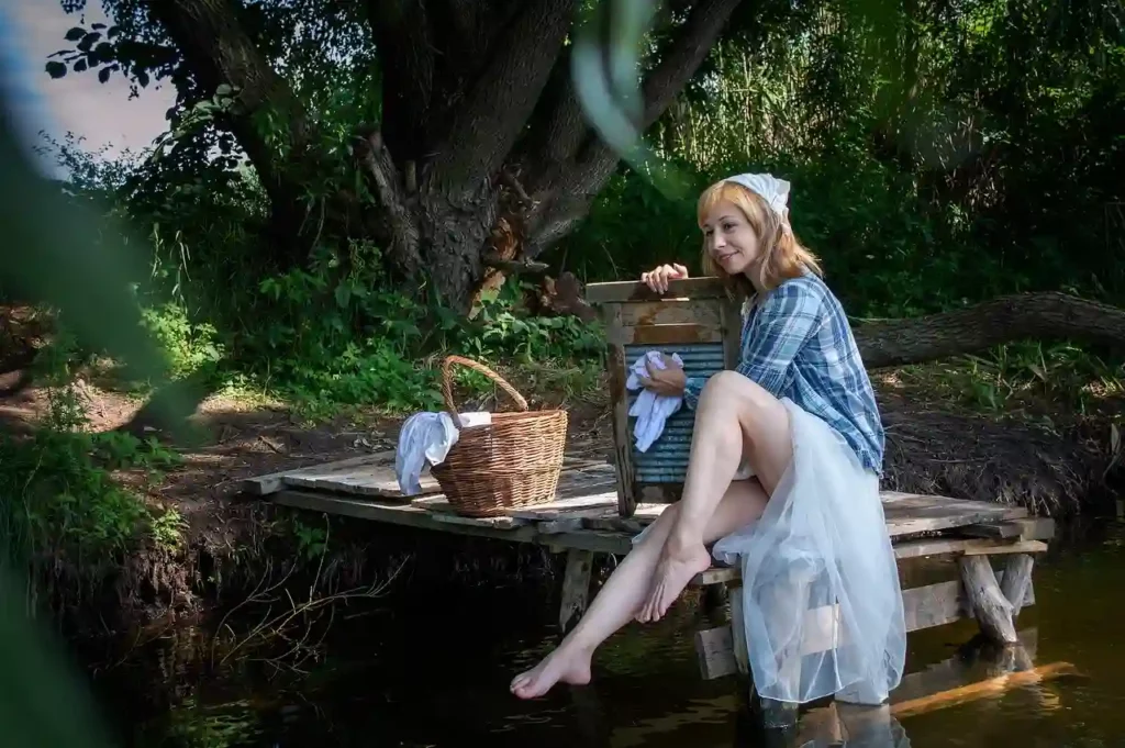 young woman washing clothes