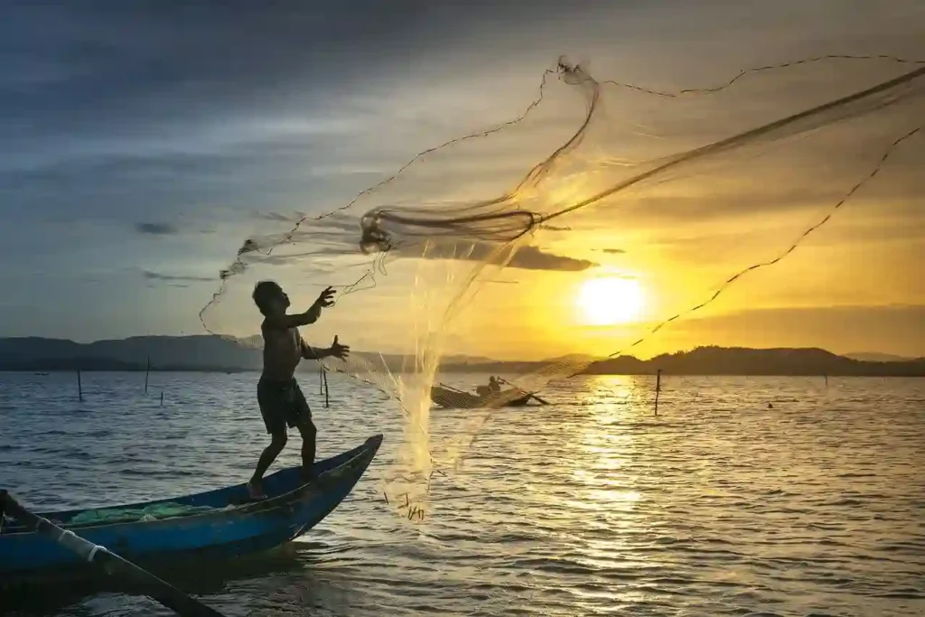 man fishing with a net