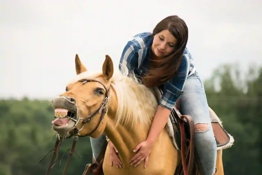 a woman riding a horse