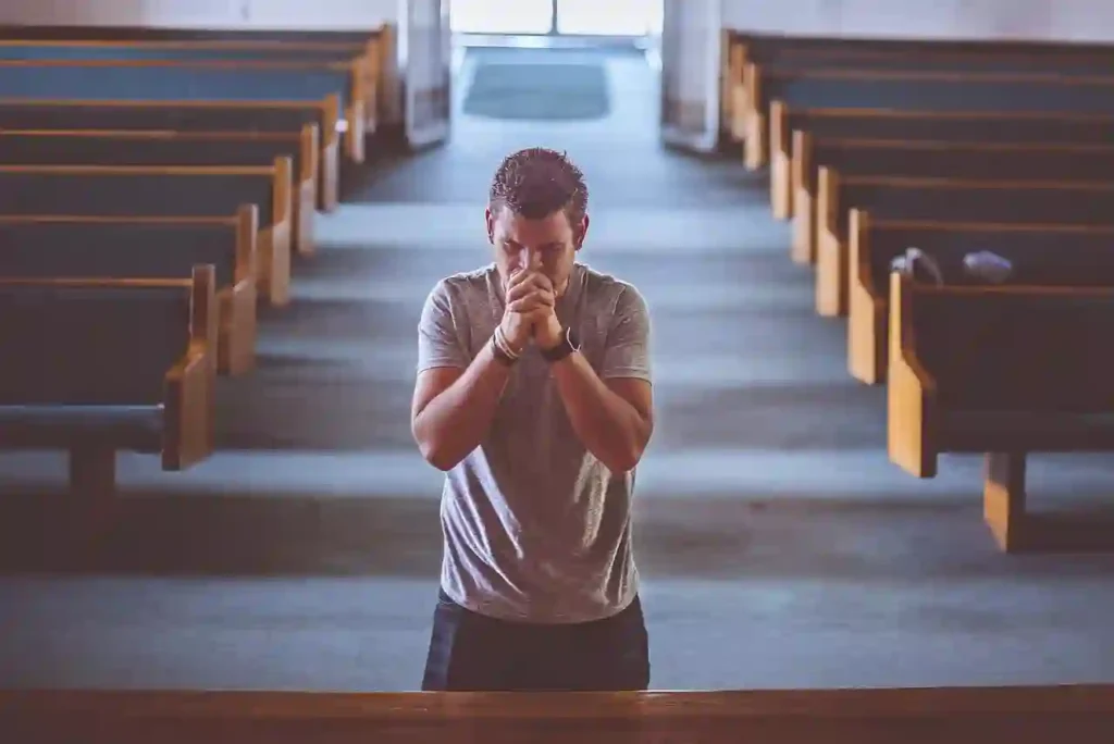 a man praying in the church